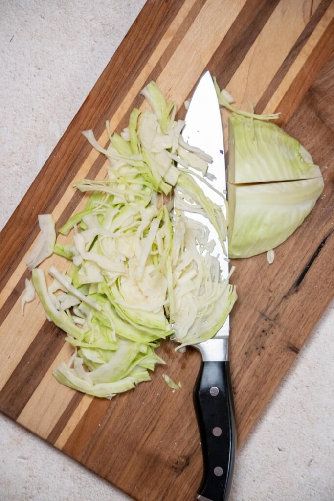 While the noodles dry, thinly slice your cabbage, and prep the remaining fresh salad ingredients. 