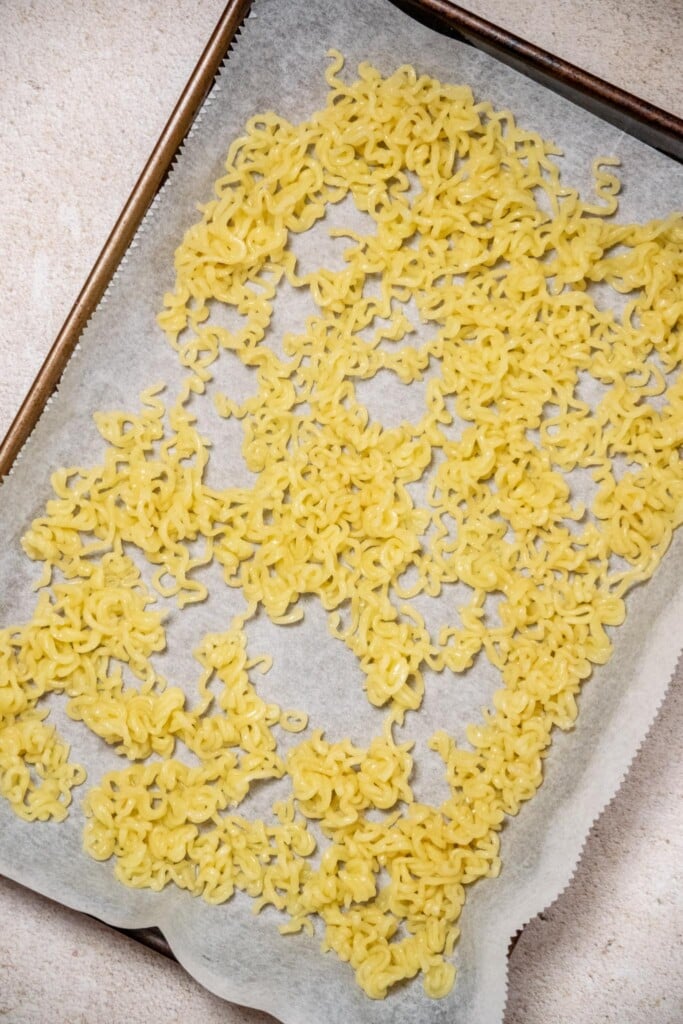 Transfer the noodles to a parchment paper lined baking sheet in an even layer, and allow to dry for 30 minutes. 