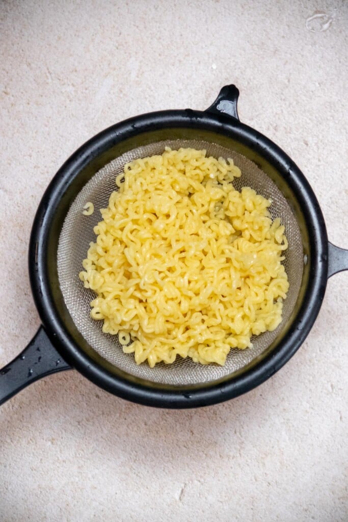 Immediately drain well to remove all excess liquid and stop cooking. 