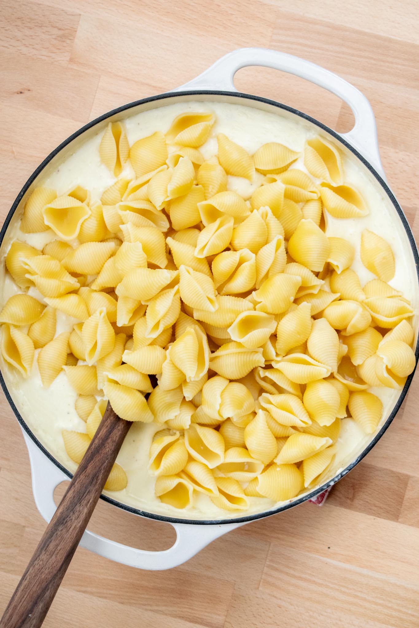 Pasta added to the cheese sauce.
