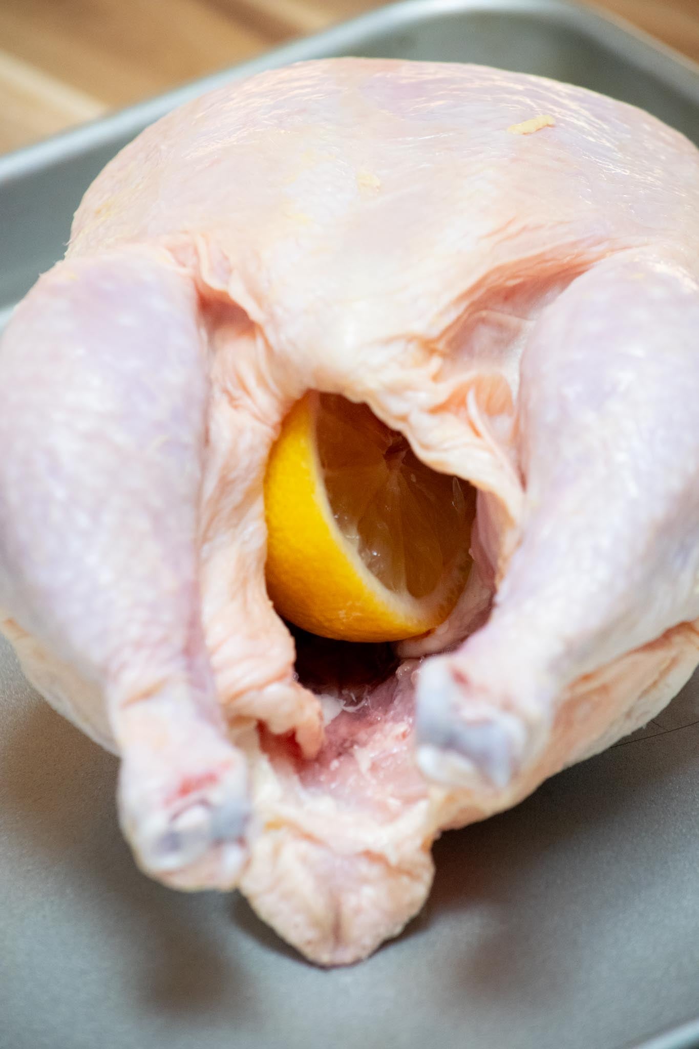 Lemon stuffed inside the chicken's cavity.